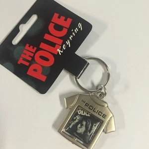 THE POLICE Reggatta de Blanc Keyring NEW - Foto 1 di 1