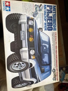 Coche de radiocontrol ancho con tapa metálica Mitsubishi Pajero 1/10 todoterreno Rock Crawler - Imagen 1 de 4