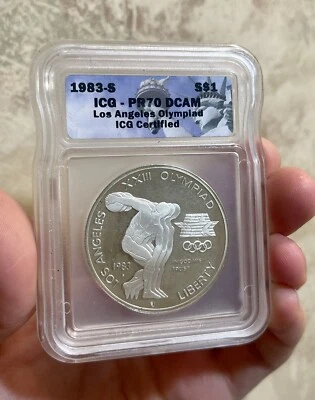1983S MINT LA SPECIAL OLYMPICS COMMEMORATIVE DOLLAR ICG PF70 ULTRA CAMEO GRADED - Image 1 of 3