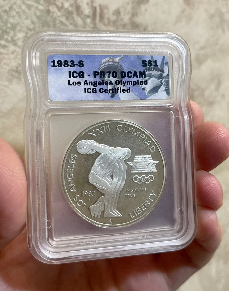1983S MINT LA SPECIAL OLYMPICS COMMEMORATIVE DOLLAR ICG PF70 ULTRA CAMEO GRADED - Image 1 of 3