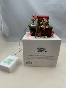 DEPT 56 Heritage Village Collection 'Untangle the Christmas Lights' 56374 funktioniert - Bild 1 von 9