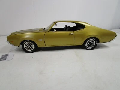 ERTL 1/18 AMERICAN MUSCLE DORADO/NEGRO 1969 OLDS CUTLASS 442 *BONITO* SIN CAJA *LEER* Foto 1 de 4
