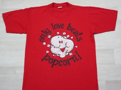 Vintage 1980's "ONLY LOVE BEATS POPCORN" FUNNY CARTOON HUMOR t-shirt (M) USA - Image 1 of 4
