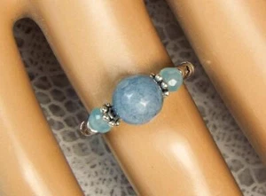 ANELLO ELASTICO CYNTHIA LYNN "TRANQUIL" MARCIA PIETRA NASCITA BLU ACQUAMARINA ARGENTO - Foto 1 di 1