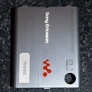 Cache batterie argent Sony Ericsson d'origine pour W995 / W995i - Photo 1 sur 3