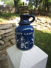 VINTAGE KEROSENE LAMP PAINTED BLUE WITH A WHITE DESIGN "LIBERTY LAMP"