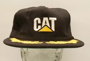 Vintage Raupe KATZE Logo Mütze schwarz Druckknopflasche Tonkin mit Blättern auf Krempe - Bild 1 von 4