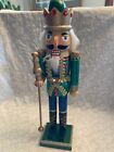 nutcracker. Soldier with baton. Green with gold trim and crown. Braid has unra