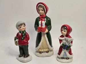 Vintage ENESCO CHRISTMAS VILLAGE FIGURINES Woman & 2 Children Carrying Gifts - Picture 1 of 4