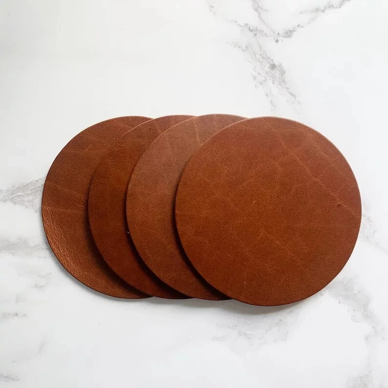 Sottobicchieri a cerchio in pelle marrone scuro vuoti, sottobicchieri in vera... - Immagine 1 di 4