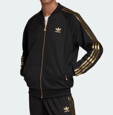 CHAQUETA DE ATLETISMO PARA HOMBRE NUEVA ADIDAS ORIGINALS SUPERSTAR 24K ~ MEDIANA ~ NEGRA DORADA ¡RARA! Foto 1 de 4