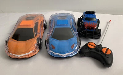 Lot of 3 Electronic Toy Cars. Light Up Racecars. Remote Control Jeep - Image 1 of 4