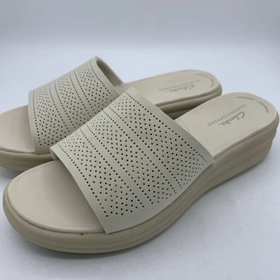 Sandalia de cuña Clarks Cloudsteppers Drift Twist para mujer 7,5 W crema deslizable Foto 1 de 4