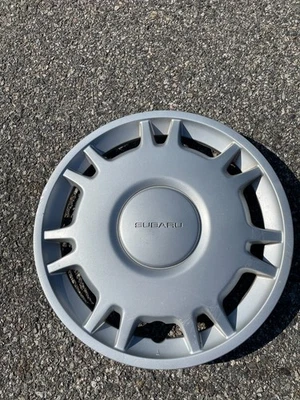 One 1995 to 1999 Subaru Legacy 14 inch hubcap wheel cover beater scratched - Image 1 of 4