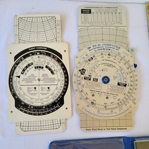 Two E6B Flight Computers 2 Flight Plotting Rulers and One Instruction Manual - Picture 1 of 4