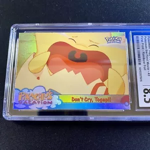 CGC 8.5 Topps Don't Cry, Togepi #43 Pokemon Il Primo Film LAMINA ARCOBALENO psa - Foto 1 di 3