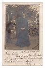 RPPC POSTCARD 1904 OLDER LADY OUTSIDE IN BLACK DRESS MILWAUKEE WISCONSIN STAMPED