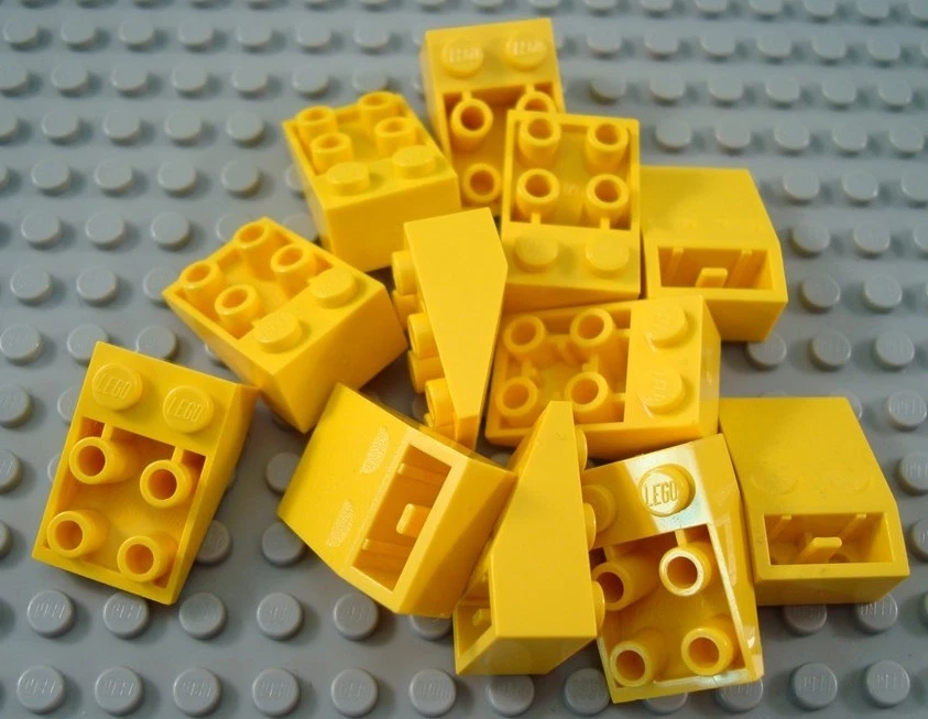 LEGO Lot of 12 Yellow 3x2 Inverted Slope Pieces - Image 1 of 1