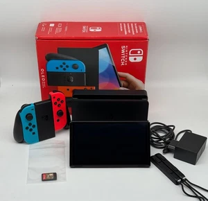 Nintendo Switch OLED - Schwarz/Neon-Blau/Neon-Rot mit Zelda: Breath of the Wild - Bild 1 von 5