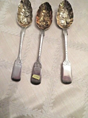 A Lot of Three British Early Victorian Sterling Silver Repousse Berry Spoons.  - Image 1 of 4