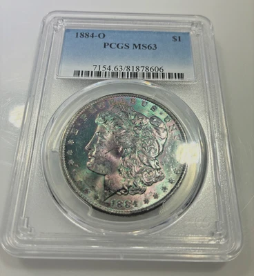 Dólar de plata Morgan 1884 O $1 graduación profesional MS63 arco iris textil tonificado color terminal Foto 1 de 4