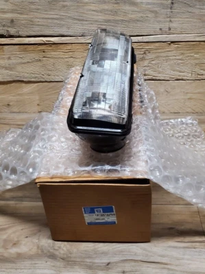 Carcasa de faros laterales para conductor Pontiac Sunbird 89-94 de fábrica fabricante de equipos originales LH GM 16516759 Foto 1 de 4