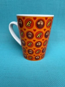 Reese's mug orange with dotted pattern of red hearts & Reese's candies - Picture 1 of 6