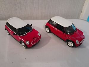 2x red mini coopers by rastar and burago 1:24 scale read discription