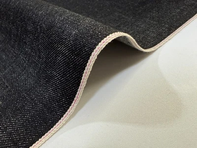 14.6 oz Japanese cotton black denim fabric with pink selvage by the yard - Image 1 of 4