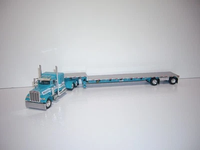 DCP FIRST GEAR 1/64 TEAL W/T STRIPES PETE 379 W/T SLEEPER&SPREAD AXLE DROP DECK - Image 1 of 4