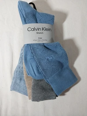 Paquete de 4 calcetines de vestir Calvin Klein para hombre de algodón peinado azul gris tostado elásticos Foto 1 de 4
