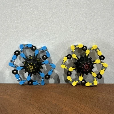 Juego de 2 juguetes antiestrés robot giroscopio giratorio con tapa giratoria deformable para dedos Foto 1 de 4