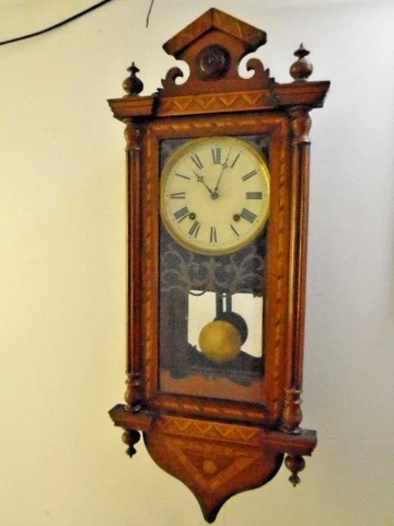 Antique Wall Clock By E N Welch with columns and inlaid marquetry case mirror Cover