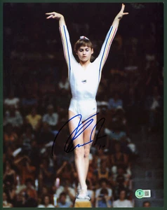 NADIA COMANECI Signed '76 Montreal Olympics Balance Beam Arms Up 11x14 Photo BAS - Picture 1 of 2