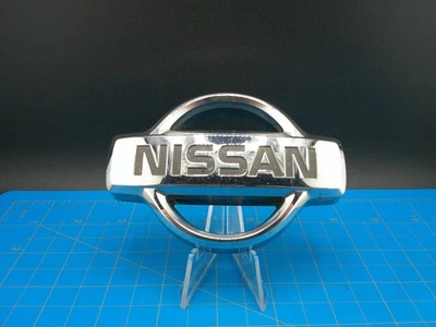 Nissan OEM Front Grille Emblem Badge Chrome 62890-0W000 Fits Pathfinder Xterra - Image 1 of 4