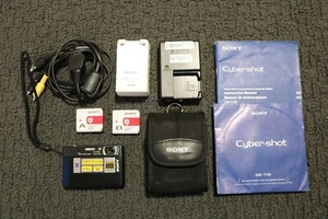 Sony Cyber-Shot DSC-T100 Black 8.1MP Digital Camera 2 Chargers 2 Batteries Cords - Picture 1 of 7