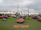 Photo  Vintage At Goodwood - Sculpture And Cars Outside The 'Let It Rock' Pavili