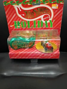 Hot Wheels Vacanze Jalopy Secchiello Verde Auto Con Babbo Natale - Foto 1 di 2