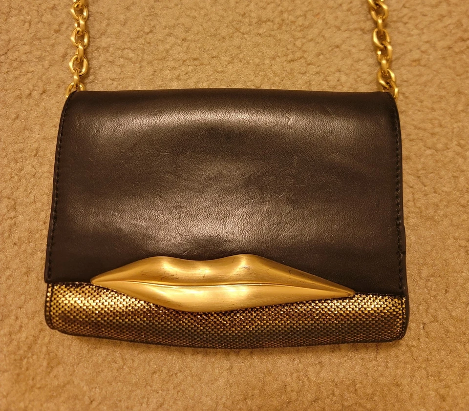 Bolso clutch de cuero Diane Von Furstenberg buen estado negro/dorado Carolina Lips Foto 1 de 4