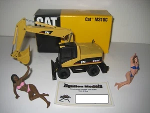 CATERPILLAR M 318 C BAGGER TIEFLÖFFEL #516.1 NZG 1:50 OVP - Picture 1 of 1