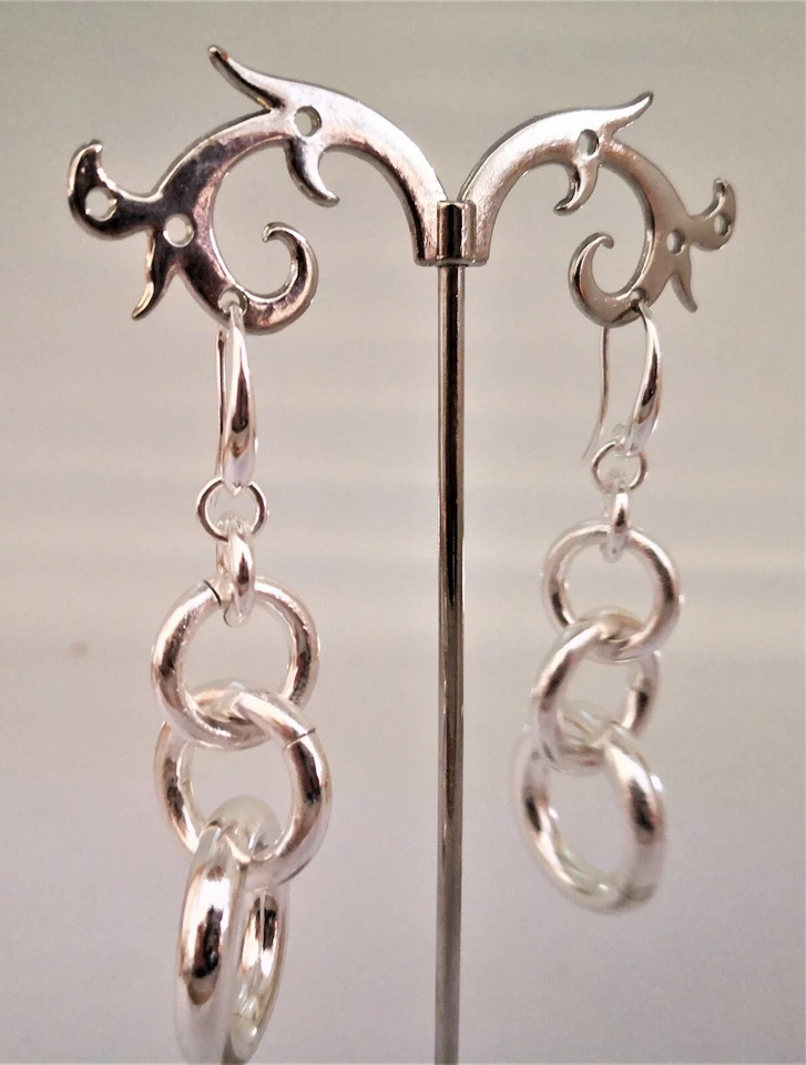 1AR UNOAERRE ORECCHINI DONNA OTTONE PENDENTI COLOR ARGENTO CERCHI CONCATENATI - Immagine 1 di 1