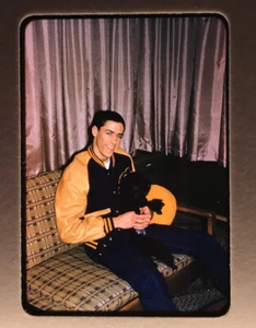 Man Letterman 1960's Kodachrome handsome young varsity jacket dog couch - Bild 1 von 3