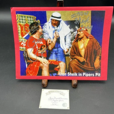 Extremely Rare Rowdy Roddy Piper And Iron Sheik Signed 8x10 - Image 1 of 4