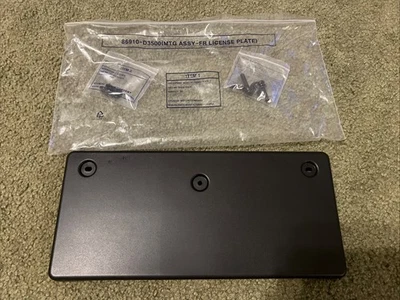 19-21 HYUNDAI TUCSON PARACHOQUES DELANTERO PLACA SOPORTE CON TORNILLOS NUEVO OEM Foto 1 de 4