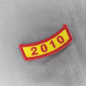 2010 2.5" Gold Red Tab Rocker Ribbon Iron On Patch - Picture 1 of 2