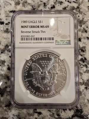 1989 American Eagle Silver Dollar Mint Error MS69 Reverse Struck Thru  - Image 1 of 4
