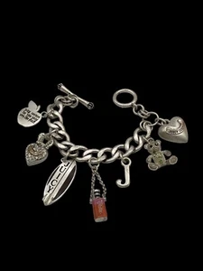 Vintage Juicy Couture Silver Plated Charm Toggle Bracelet w/7 Charms Pre-owned - Picture 1 of 16