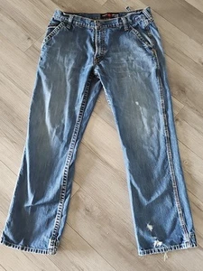 Pantalones de mezclilla Ariat FR azul tiro bajo M4 bota para hombre 36X32 desgastados descoloridos usados - Imagen 1 de 22