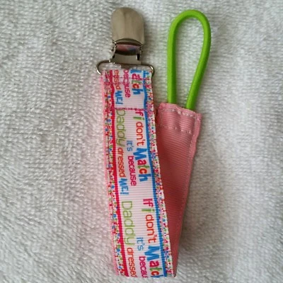 Soporte chupete/pacificador bebé con clip de metal/papás niña Foto 1 de 4