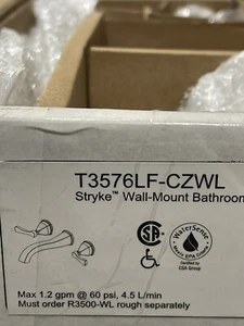 Grifo de baño Stryke montado en la pared T3576-CZWL champán bronce NUEVO EN CAJA - Imagen 1 de 8